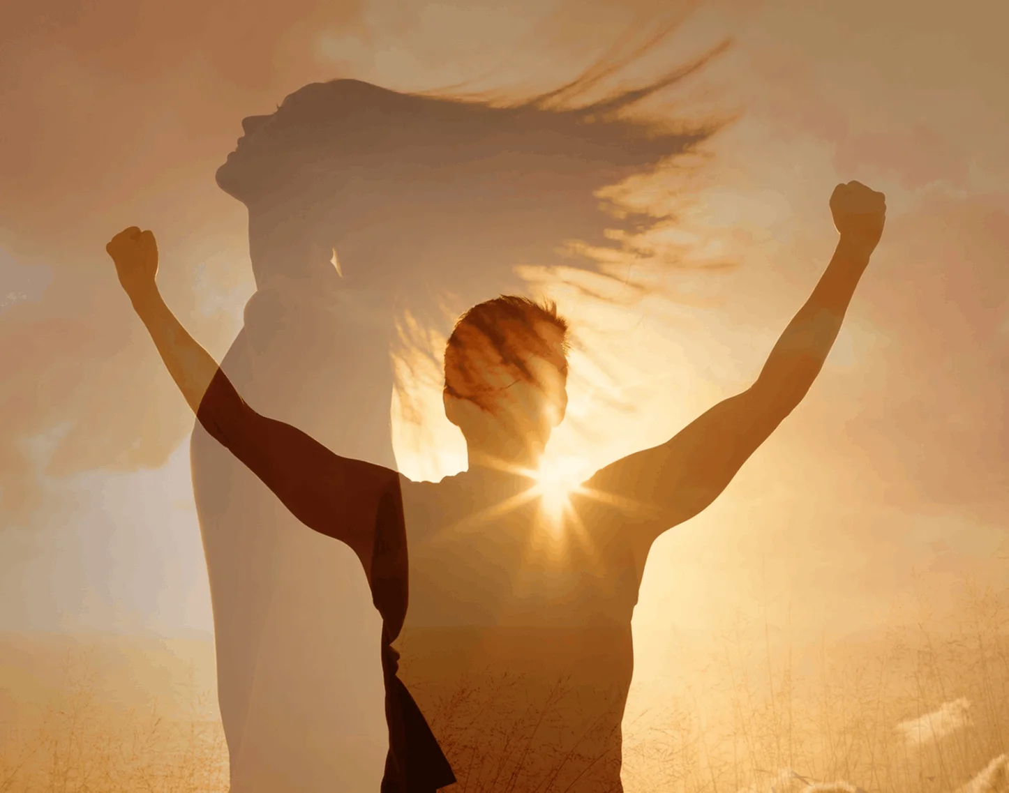 A person with their arms raised in the air.